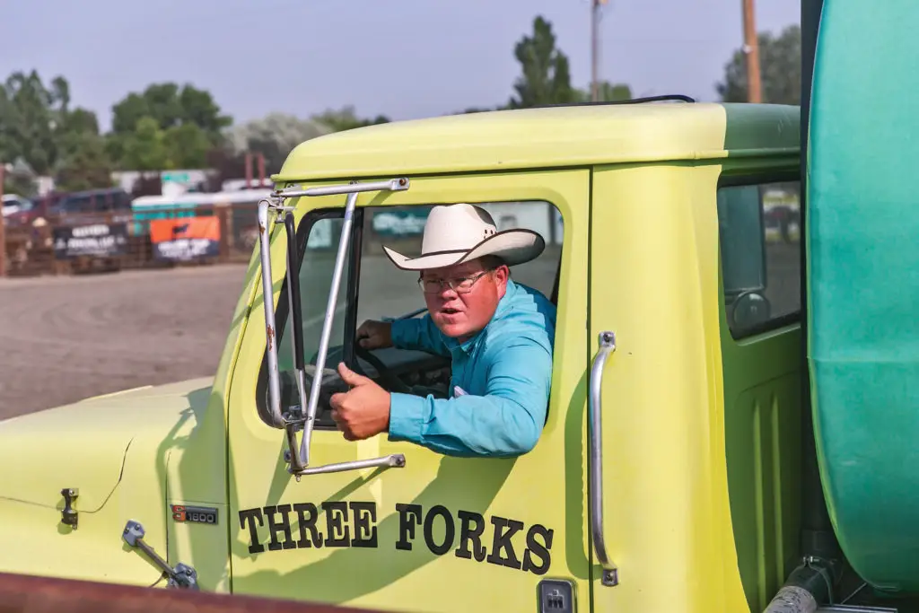 Whobee Hughes driving water truck